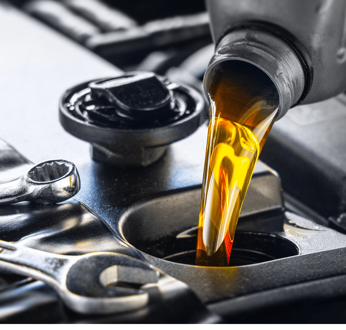 Fresh motor oil being added